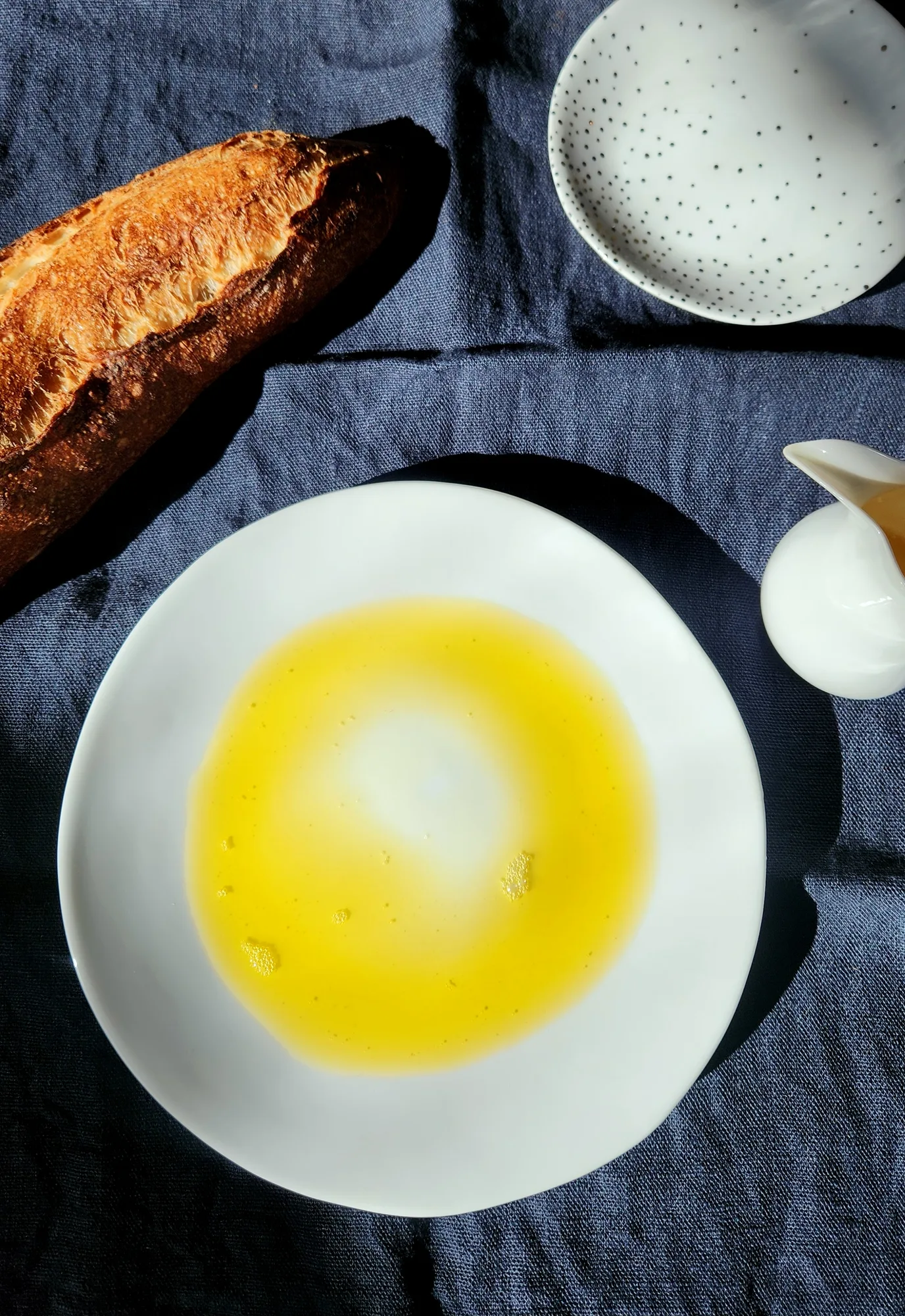 plated dish with bread and oil